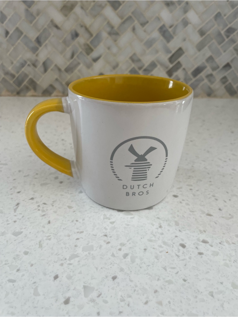 Dutch Bros White Mug with Yellow Interior and Handle